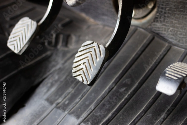 Obraz Three driving pedal with a manual transmission. Pedals in the car. Manual gearbox. Black three pedals in the car