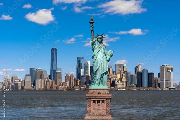 Fototapeta The Statue of Liberty over the Scene of New york cityscape river side which location is lower manhattan,Architecture and building with tourist concept