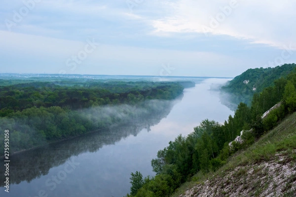 Fototapeta dawn on river. fog on the river. overcast sky