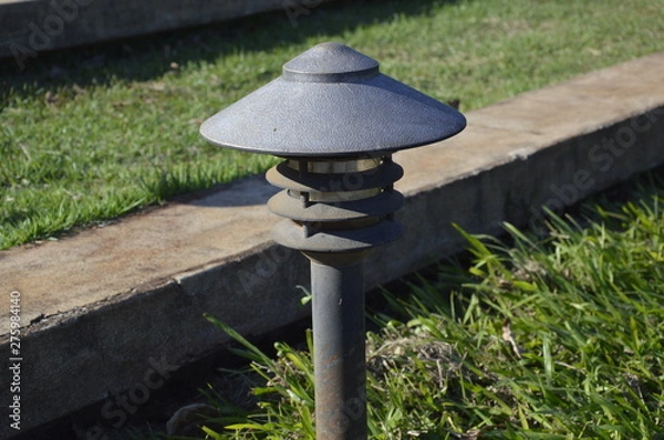 Obraz old lamp in garden
