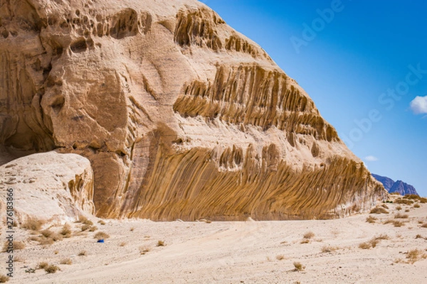 Fototapeta Desert with sandstone and granite rock in shape of boat in Wadi Rum in Jordan