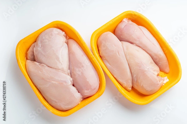 Obraz Raw chicken fillet package isolated on white background.