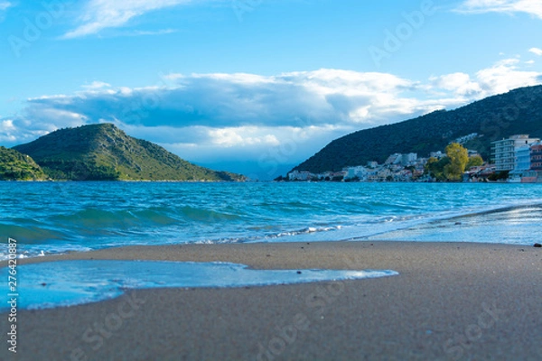 Fototapeta Small town Tolo, located near Nafplio in cozy sea bay with clear water and fine sand, summer vacation destination for families with kids