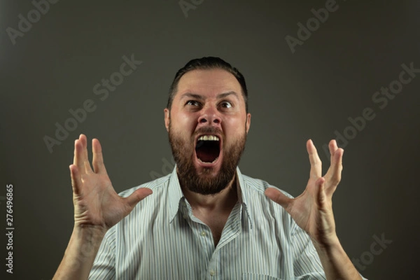 Fototapeta Stressed business man. Caucasian man yeling and pulling hair. Angry business