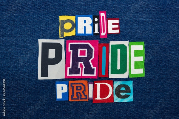 Fototapeta PRIDE PRIDE PRIDE collage of word text, multi colored fabric on blue denim, LGBTQ inclusion concept, horizontal aspect