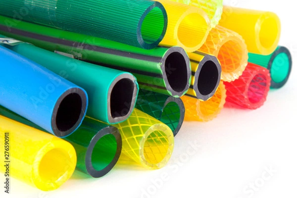 Obraz colorful gardening hoses on white background