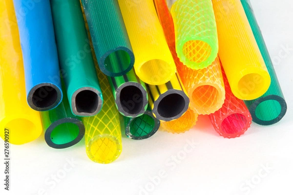 Obraz colorful gardening hoses on white background
