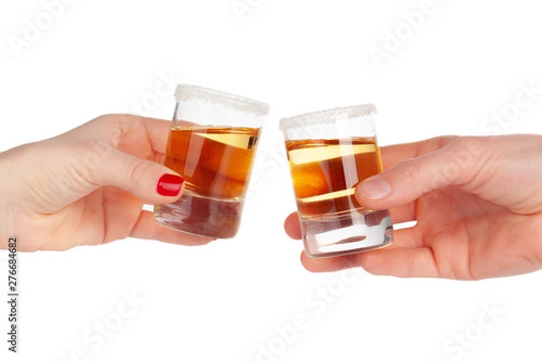 Obraz Two hands clinking shots of alcoholic beverage together