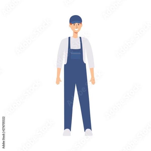 Fototapeta Delivery man or worker in uniform and a cap stands in front view.