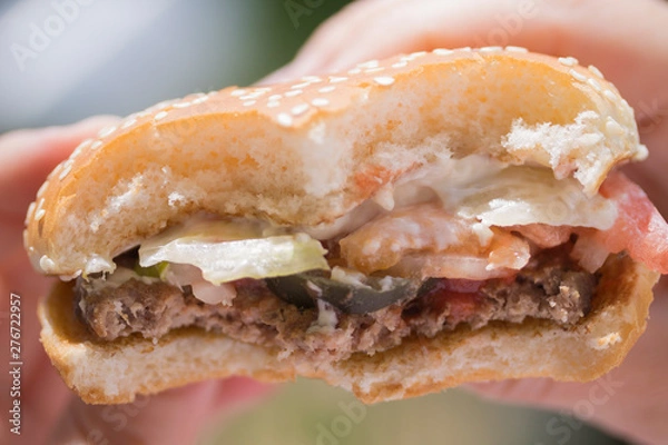 Obraz Bitten hamburger close-up.