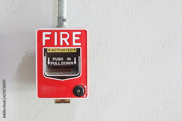 Fototapeta Fire alarm switch on the wall in factory.