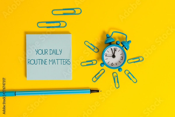 Obraz Word writing text Your Daily Routine Matters. Business photo showcasing practice of regularly doing things in fixed order Metal alarm clock wakeup clips ballpoint notepad colored background