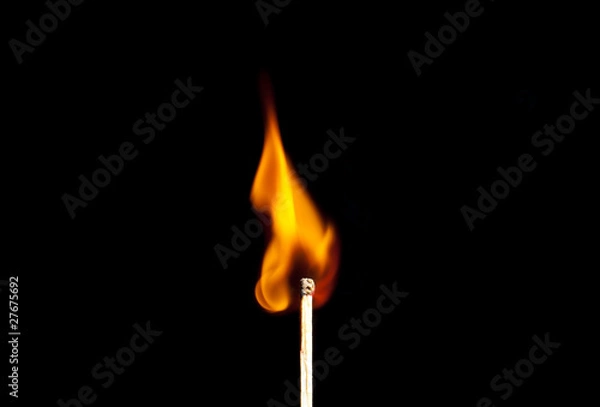 Obraz burning match on black background