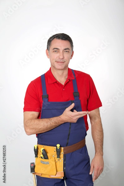 Obraz Carpenter standing on white background