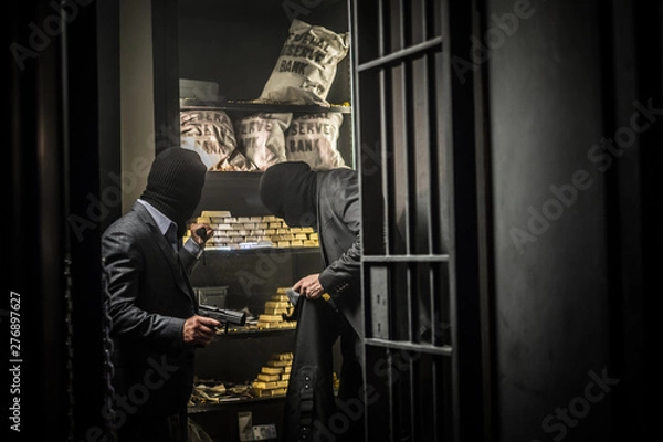 Fototapeta Two ardmed men robbing a bank