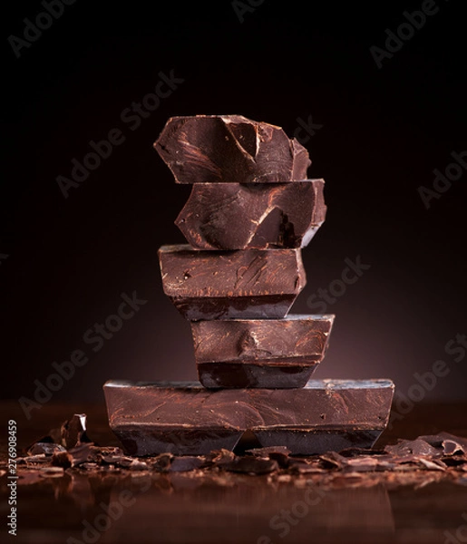 Obraz Chopped chocolate on a dark marble background