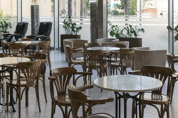 Fototapeta tables and chairs in cafe