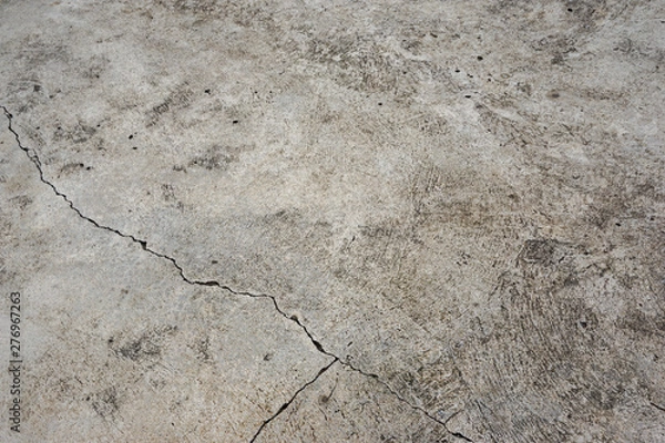 Fototapeta The cement floor is not grey. There are cracks. Divide the cement into 3 parts unequal size. Texture or background.
