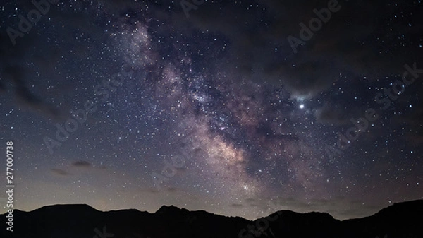 Fototapeta Milky Way over the mountain peaks
