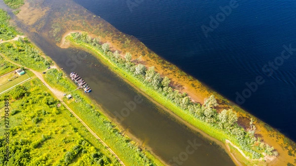 Fototapeta  Aerial view from the drone of landscape Volga river flows among the hills and fields. The middle band of Russia.