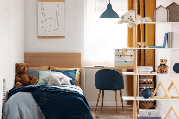 Obraz Workspace with desk and chair in elegant teenager's room with blue and orange design