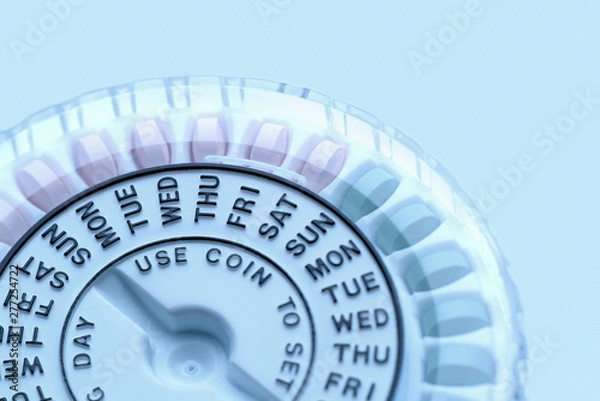 Obraz Closeup of birth control pill dispenser showing days of the week