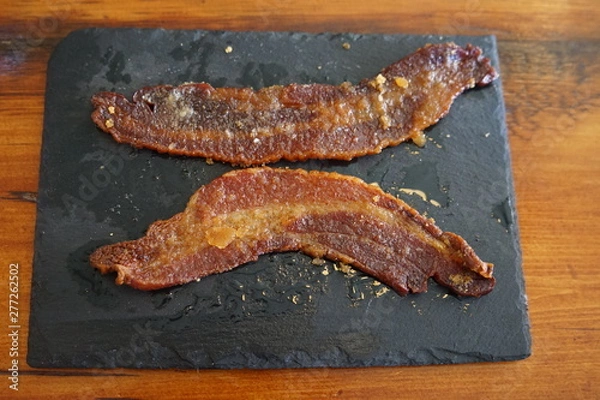 Obraz Two Slices of Country Bacon on a Slate Plate