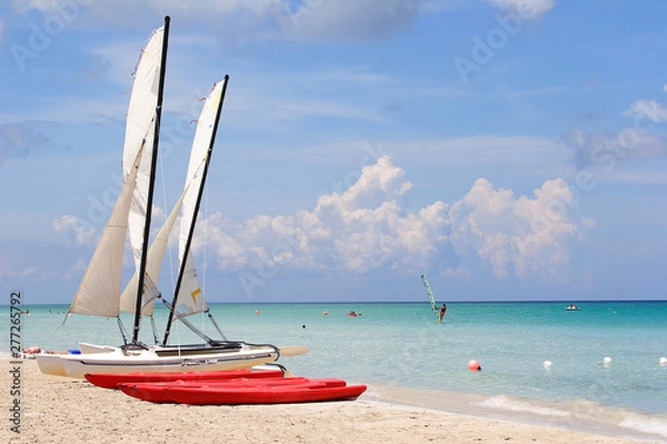 Fototapeta Beach with small sailboats