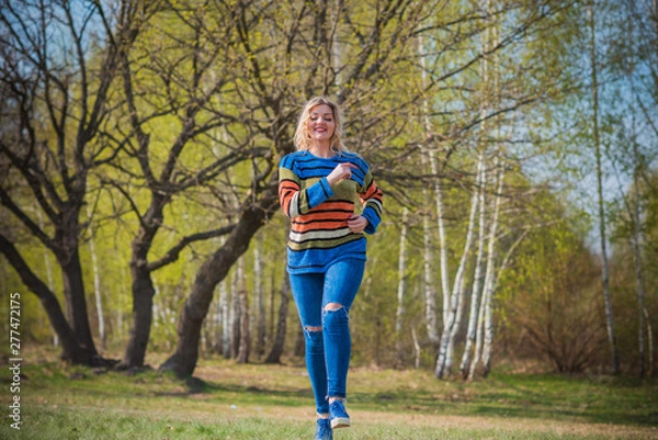 Fototapeta Autumn casual style, plus size model in colorful sweater 