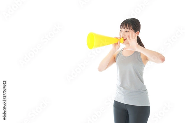 Fototapeta スポーツの応援をする若い女性