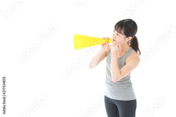 Fototapeta スポーツの応援をする若い女性