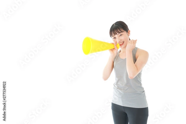 Fototapeta スポーツの応援をする若い女性