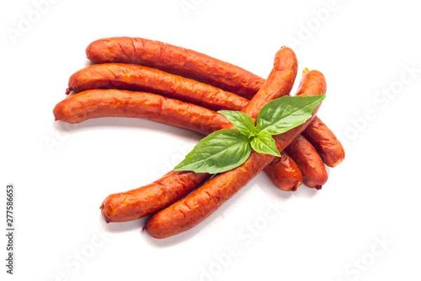 Fototapeta Dry Sausages with basil leaves, close-up, isolated on white background.
