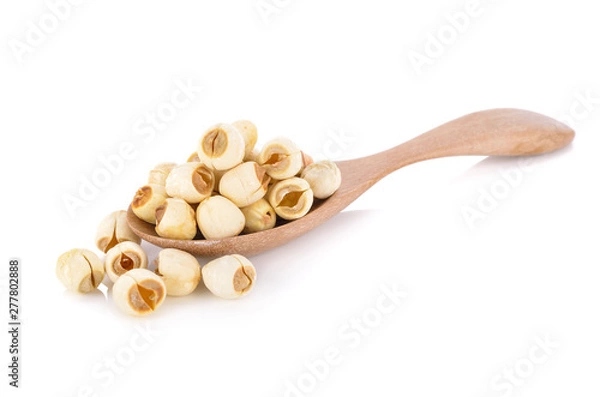 Obraz dried lotus seeds on wooden spoon with white background