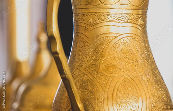 Obraz Close-up of golden arabic brass coffee pot.