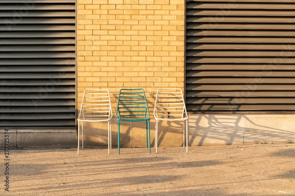 Fototapeta three chairs in a row