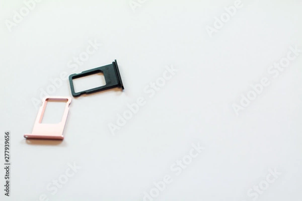 Fototapeta The SIM tray black and pink is used by the manufacturer. In the shop Real place, white background clear
