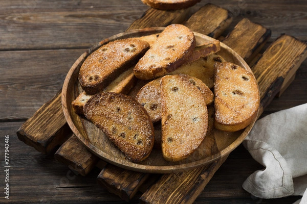 Fototapeta Crackers with raisins and sugar. Rustic style