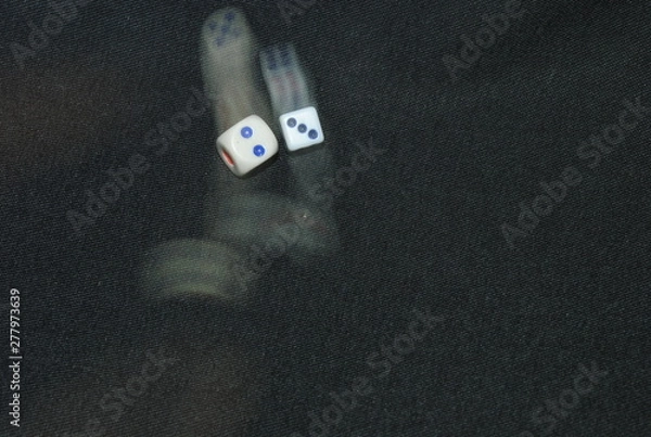 Fototapeta blur traces of dice whisk in black background