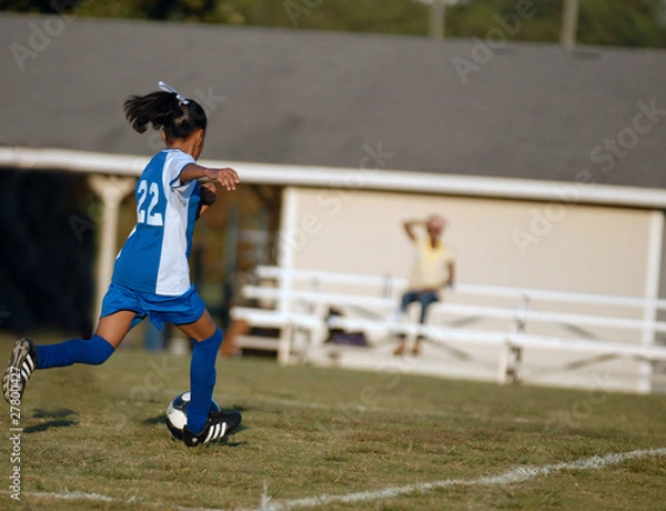 Obraz girl chasing soccer ball
