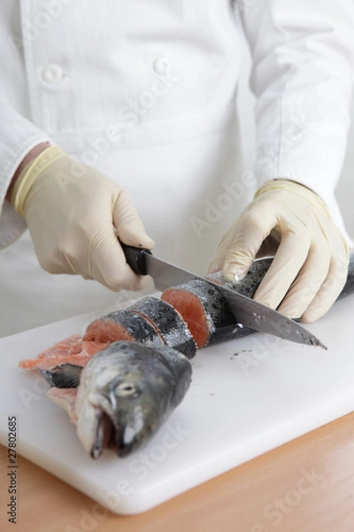Obraz Cook cutting a fish