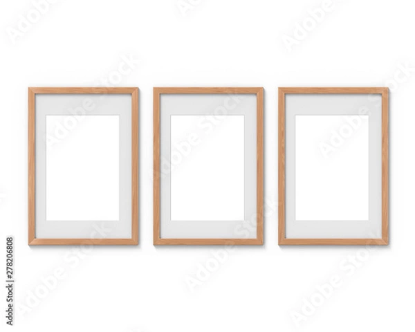 Fototapeta Set of 3 vertical wooden frames mockup with a border hanging on the wall. Empty base for picture or text. 3D rendering.