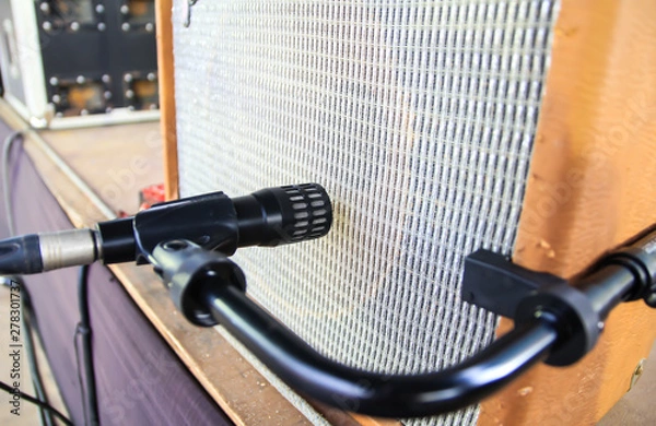 Fototapeta Microphone near guitar amplifier