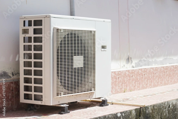 Fototapeta Air conditioner compressor outside unit.	