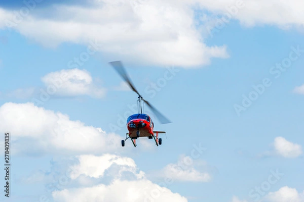 Fototapeta Red gyroplane in flight