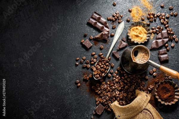 Fototapeta Coffee beans with props for making coffee