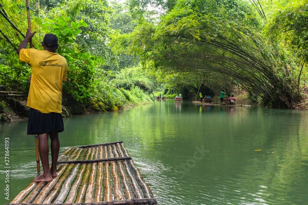 Fototapeta Gentle River Rafting through the rain forest.