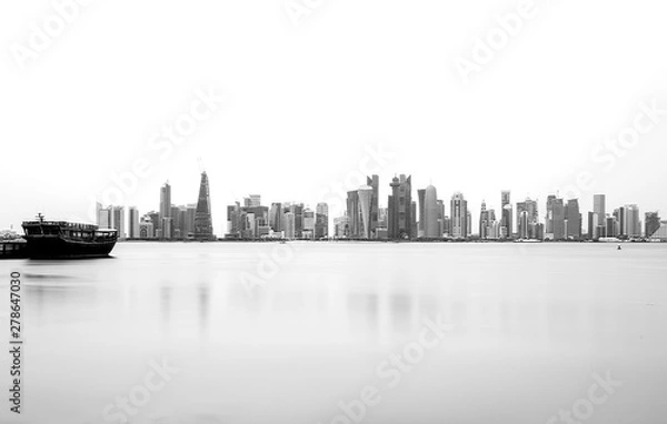 Fototapeta Silhouette of the  Modern Architectural Buildings of Doha skyline.