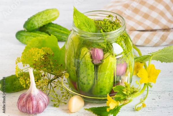 Obraz Pickled cucumbers on a light background.