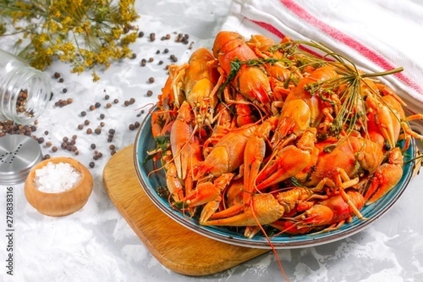 Obraz Boiled crayfish with spices. Boiled crayfish on a plate, on a concrete background. Natural product.